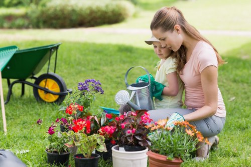 Professional landscaper assessing garden space for a Wimbledon property